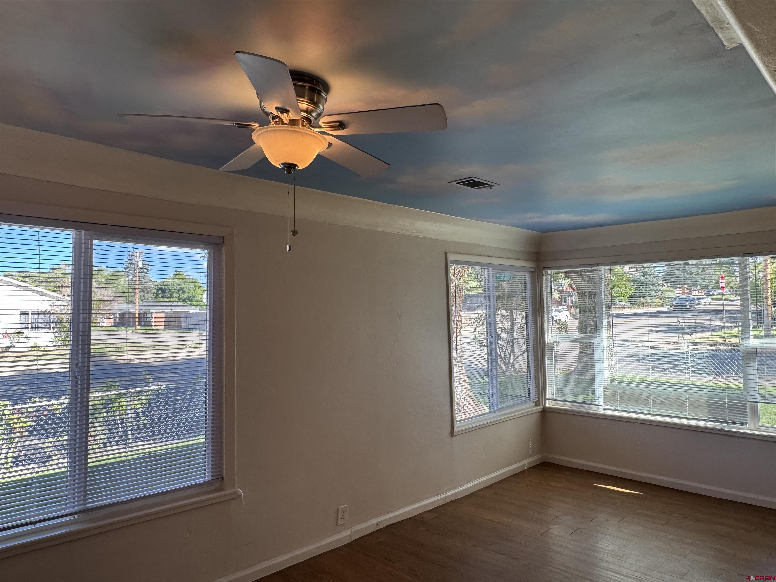 210 West Coronado Avenue Cortez, CO 81321 - Photo 2 of 41 a room with furniture and a large window