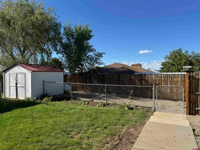 a backyard of house with lots of green space