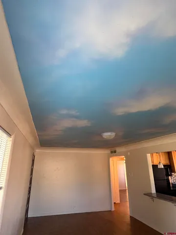 a view of hallway with furniture