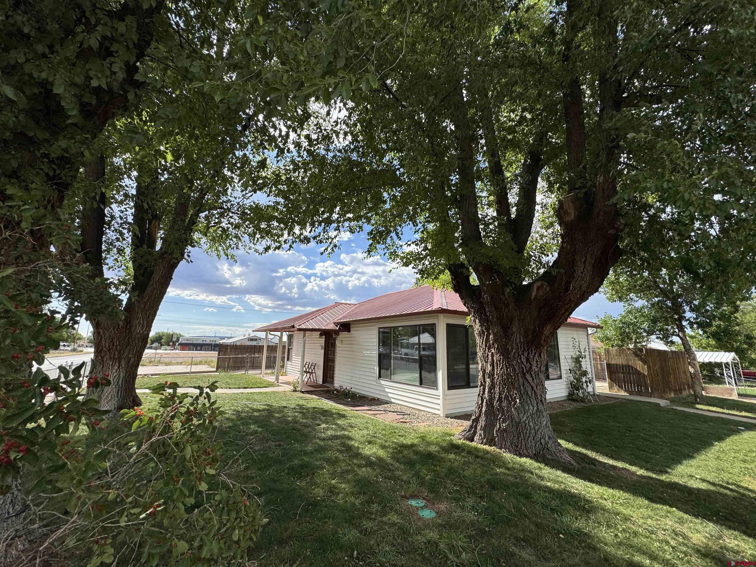 210 West Coronado Avenue Cortez, CO 81321 - Photo 30 of 41 a front view of a house with a yard