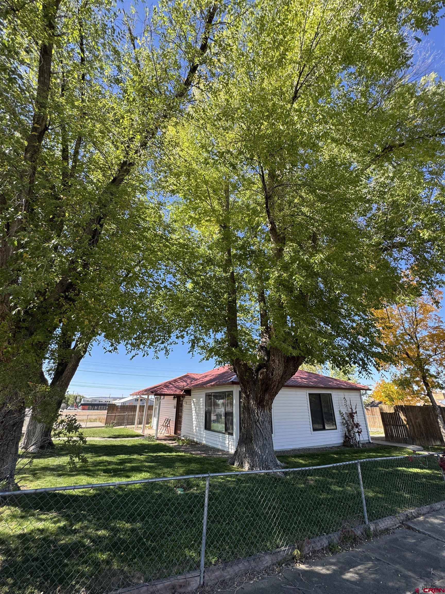 210 West Coronado Avenue Cortez, CO 81321 - Photo 34 of 41 a front view of a house with garden