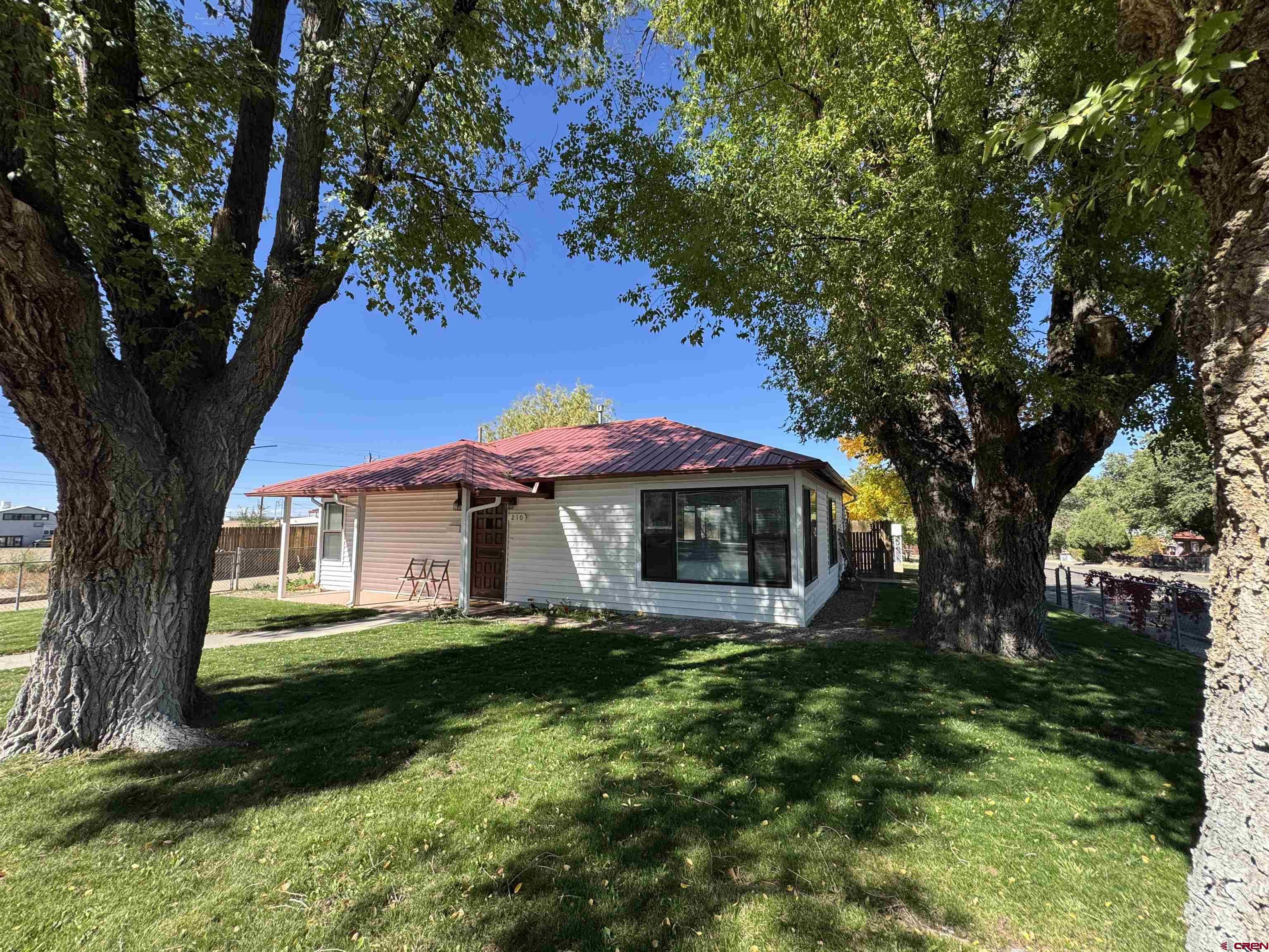 210 West Coronado Avenue Cortez, CO 81321 - Photo 6 of 41 a view of a house with a yard
