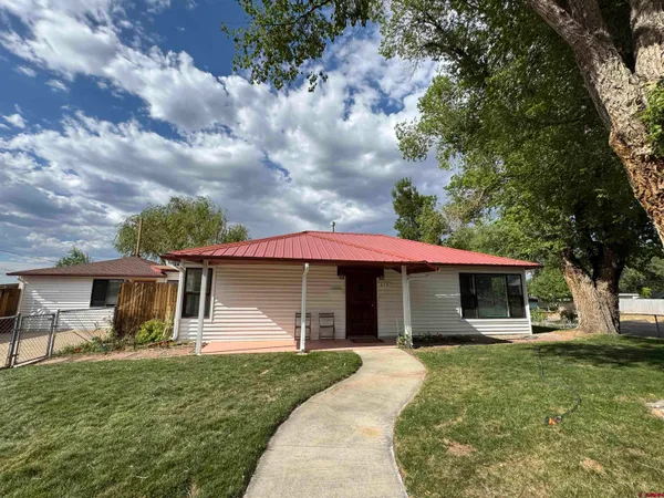 a front view of house with yard