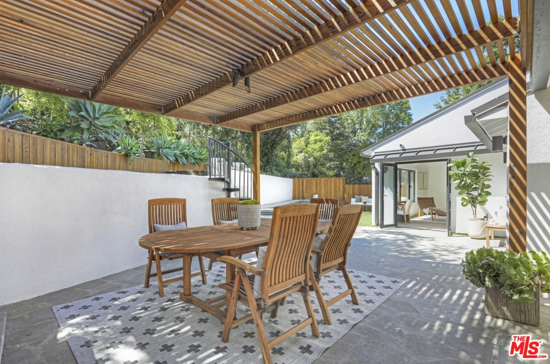 2425 Rinconia Drive Los Angeles, CA 90068 - Photo 21 of 32 a view of a table and chairs in patio