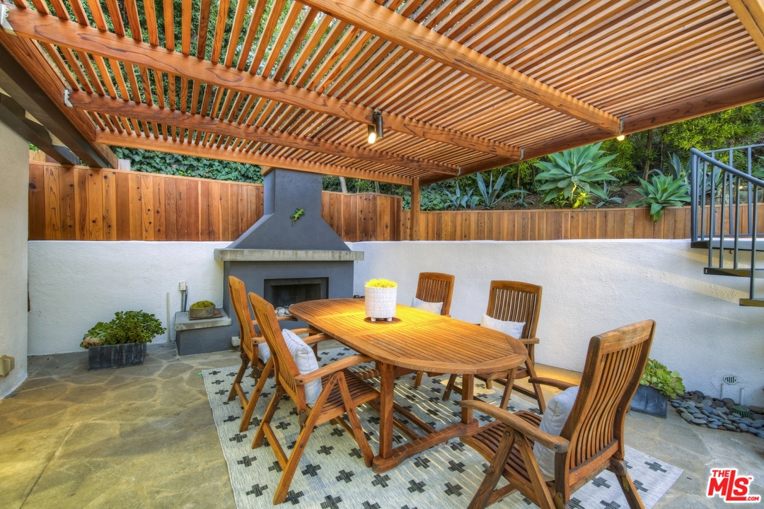 2425 Rinconia Drive Los Angeles, CA 90068 - Photo 30 of 32 a patio with table and chairs