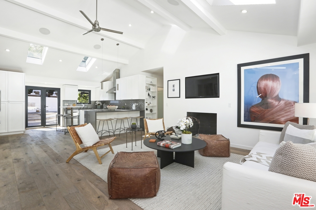2425 Rinconia Drive Los Angeles, CA 90068 - Photo 6 of 32 a living room with furniture and a fireplace