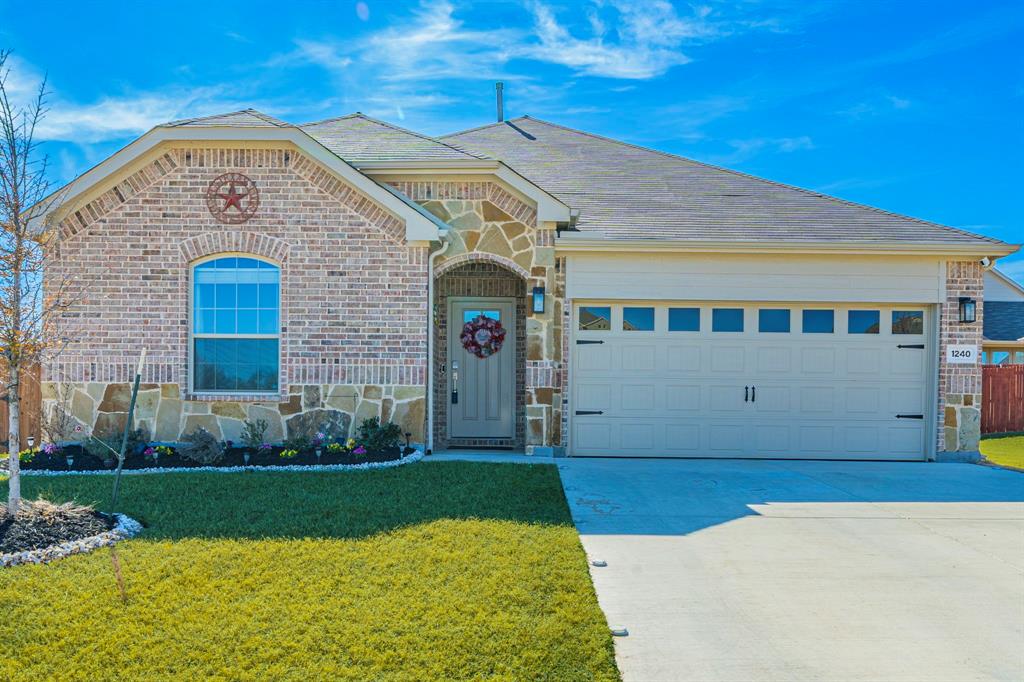 a front view of a house with yard