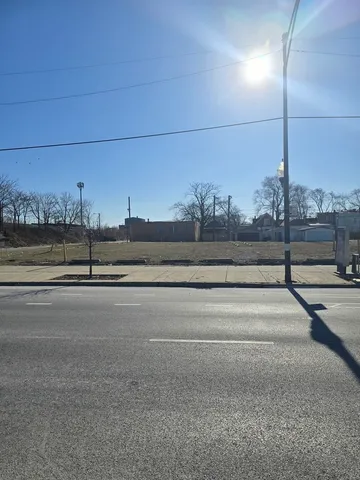 a view of a road with a building in the background