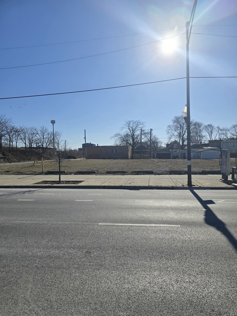 a view of a road with a building in the background