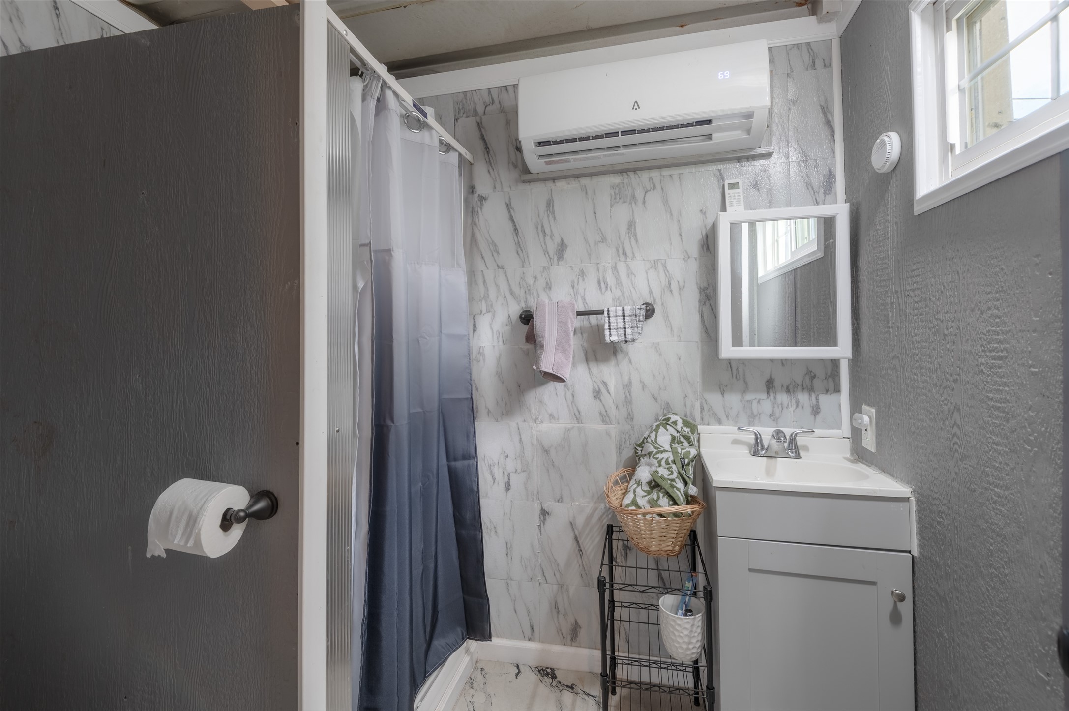 159 Pecan Avenue Groveton, TX 75845 - Photo 23 of 27 a bathroom with a shower and a sink