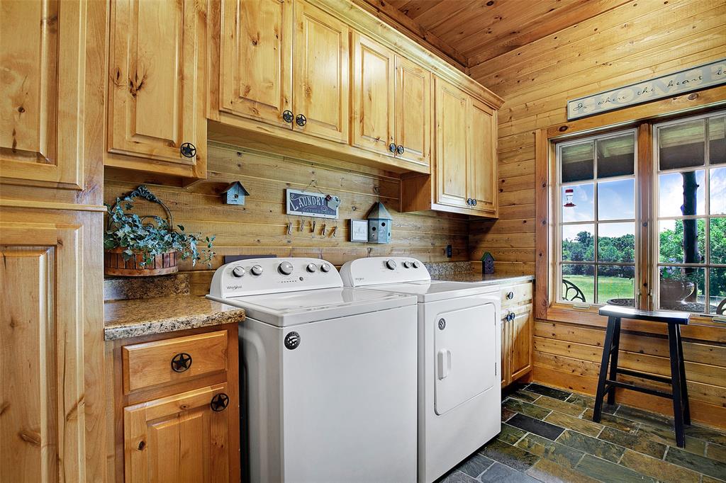 575 County Road 1214 Quitman, TX 75783 - Photo 14 of 39 a view of washer and dryer with kitchen area