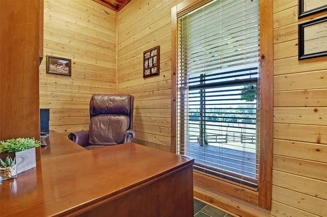 a wooden bench sitting in front of a building