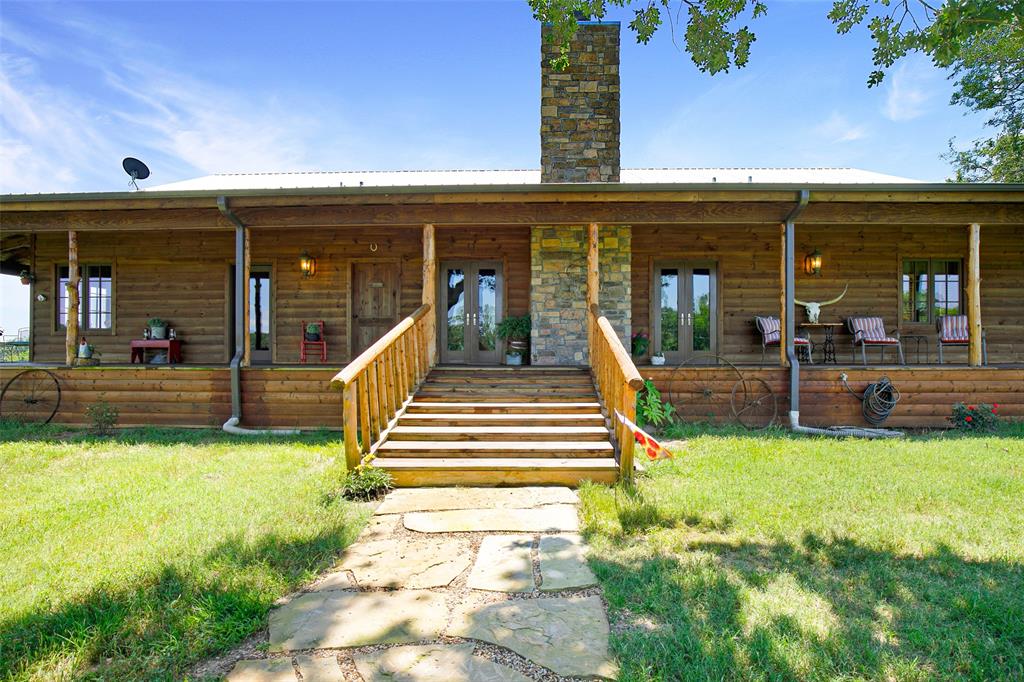 575 County Road 1214 Quitman, TX 75783 - Photo 4 of 39 a view of a house with swimming pool and sitting area