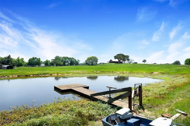 a view of a lake with a big yard