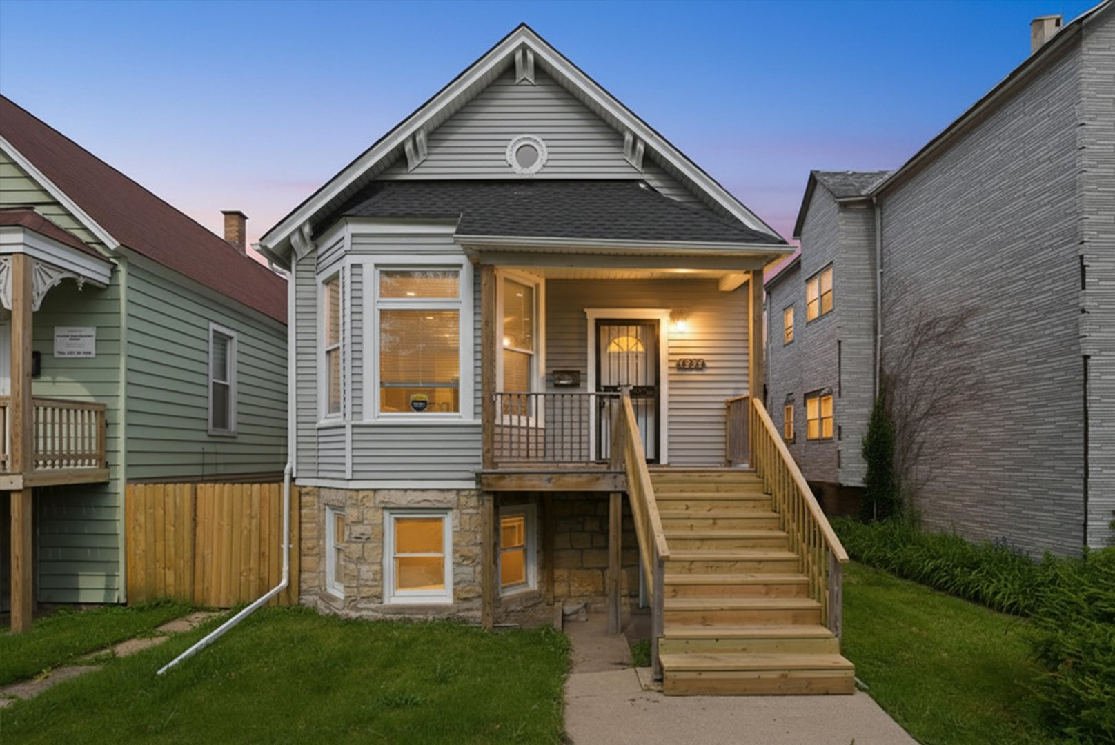 7828 South Escanaba Avenue Chicago, IL 60649 - Photo 2 of 41 a front view of a house with wooden fence