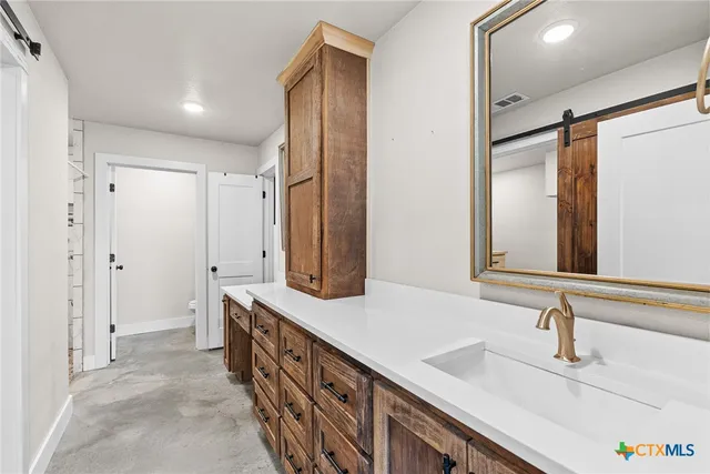 a view of room with cabinet and windows