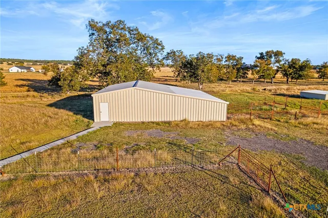 a living room with furniture and a shower