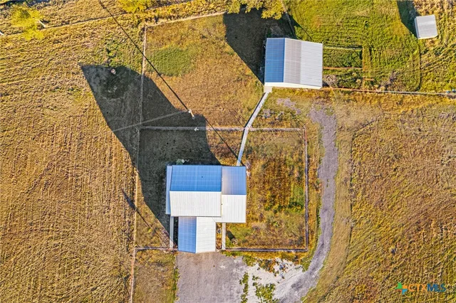 a view of a house with floor to ceiling windows