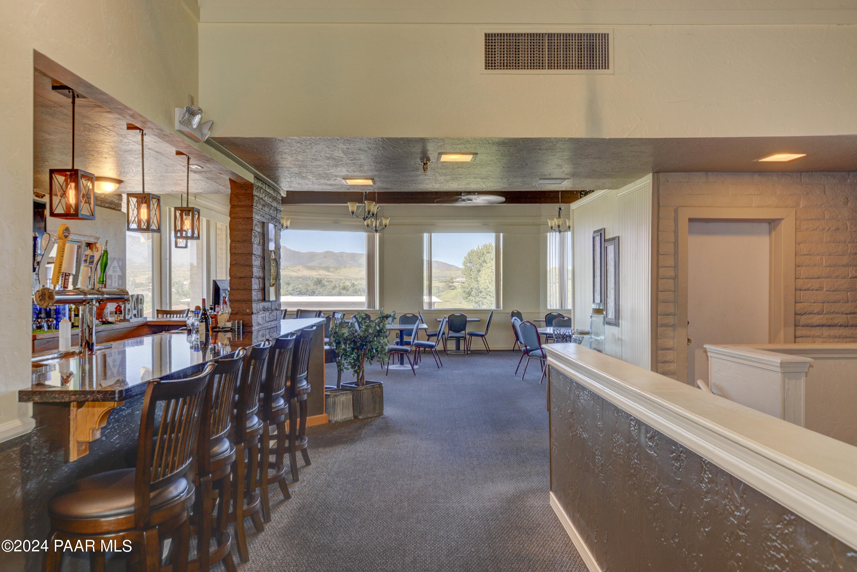12026 East Turquoise Circle Dewey, AZ 86327 - Photo 14 of 29 a large living room with furniture and large windows