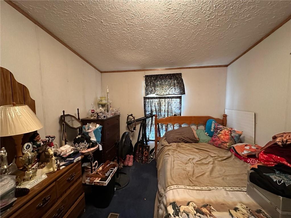 562 Palmer Adah Road Adah, PA 15410 - Photo 24 of 46 a bedroom with furniture and a window