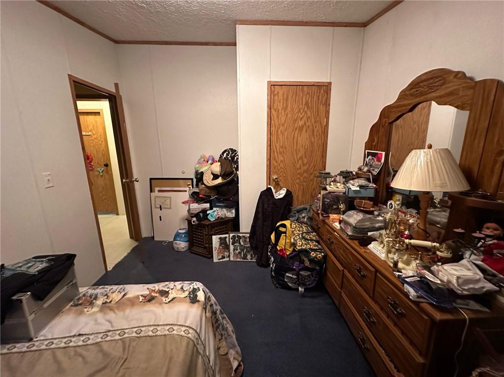 562 Palmer Adah Road Adah, PA 15410 - Photo 25 of 46 a bed room with furniture and a mirror