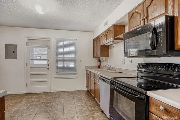 a kitchen with a stove and a microwave