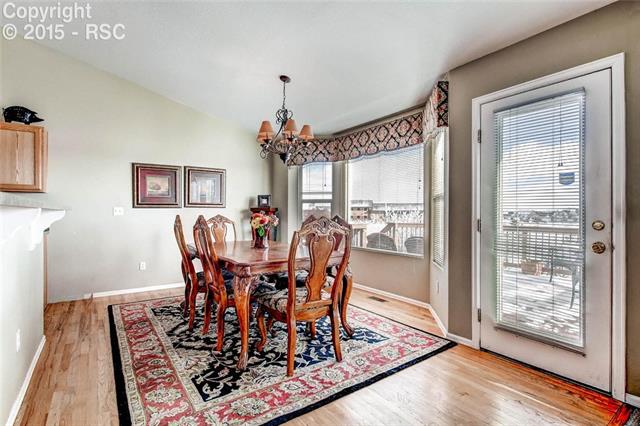 9425 Winged Foot Road Peyton, CO 80831 - Photo 10 of 28 Bright, open dining space with bay-window and walks out to large porch.