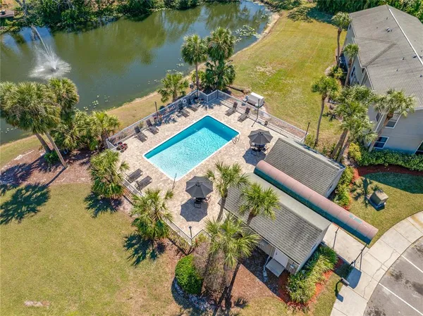 an aerial view of a house with a lake view