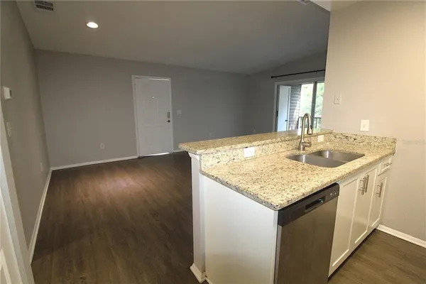 an empty room with wooden floor