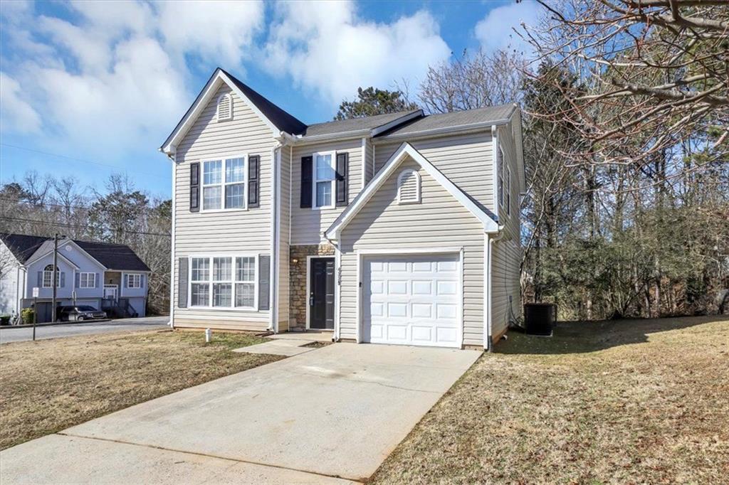 4229 Reeshemah Street Union City, GA 30349 - Photo 1 of 1 front view of a house with a yard