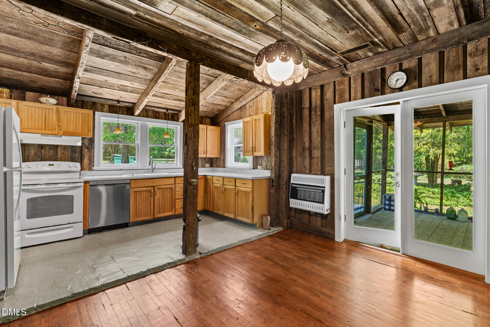 3415 Mt Willing Road Efland, NC 27243 - Photo 7 of 36 a kitchen with stainless steel appliances granite countertop a stove and a refrigerator