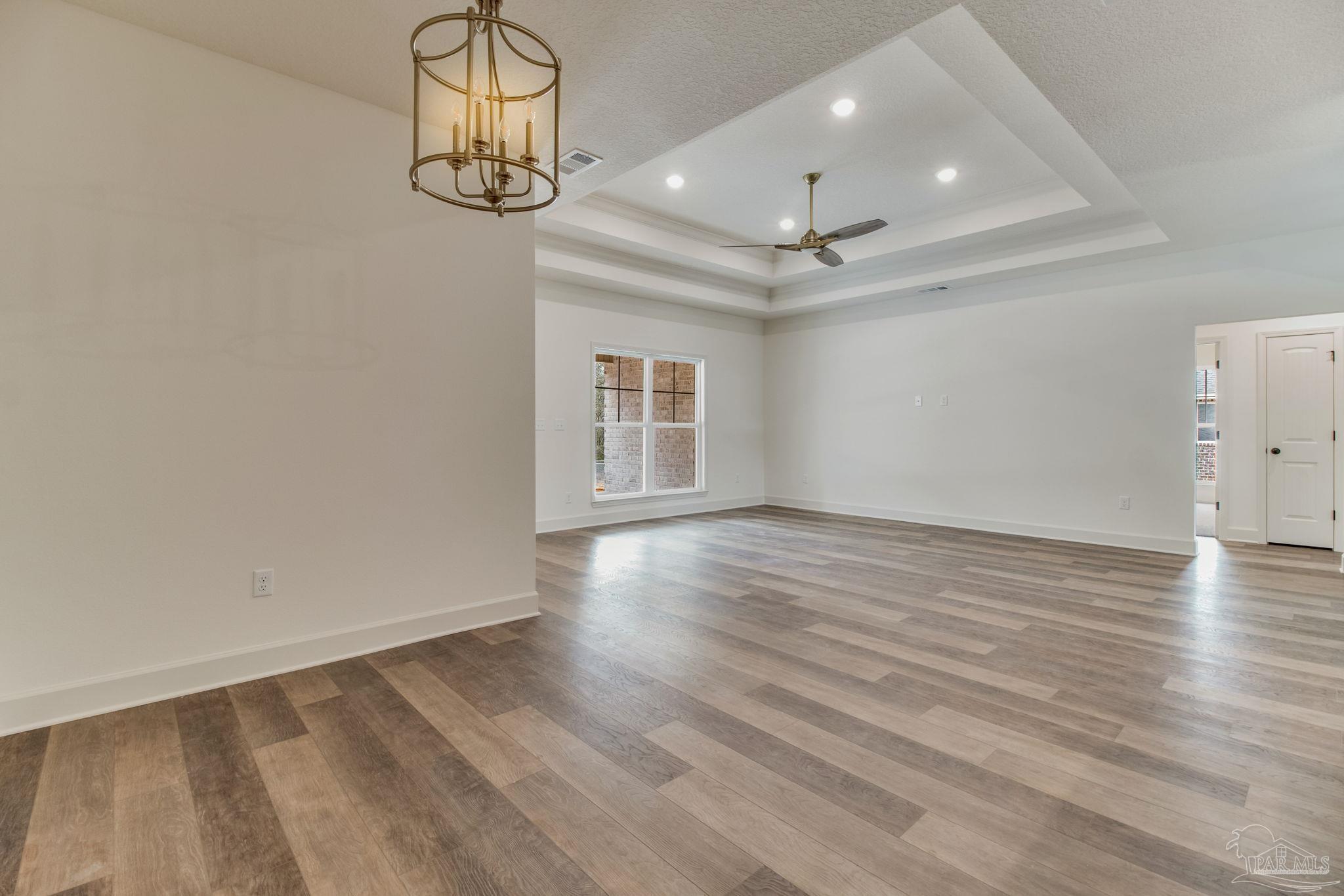 4310 Watkins Street Pace, FL 32571 - Photo 24 of 58 wooden floor in an empty room with a window