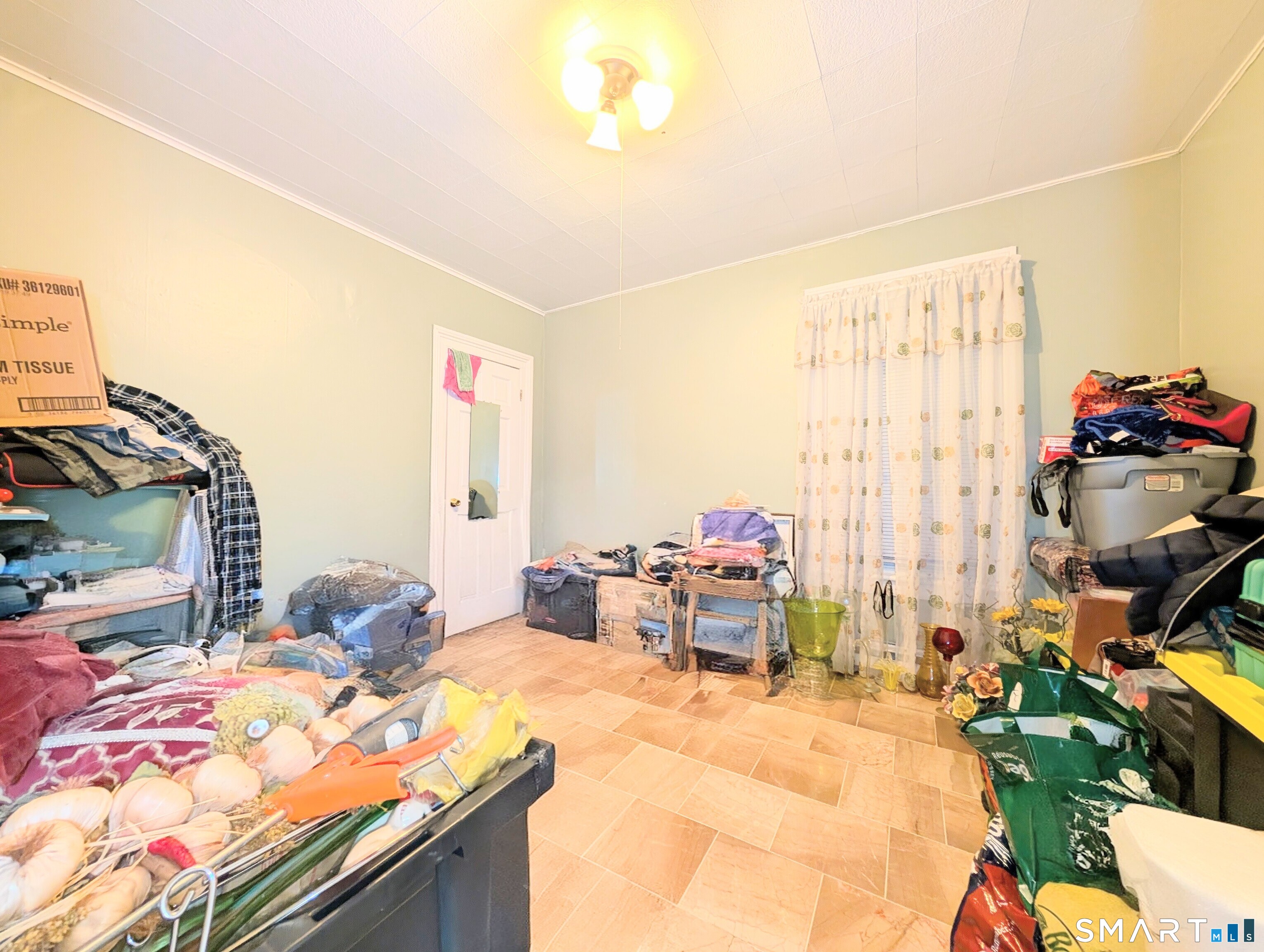 454 Pembroke Street Bridgeport, CT 06608 - Photo 16 of 40 a bedroom with a bed and a couch