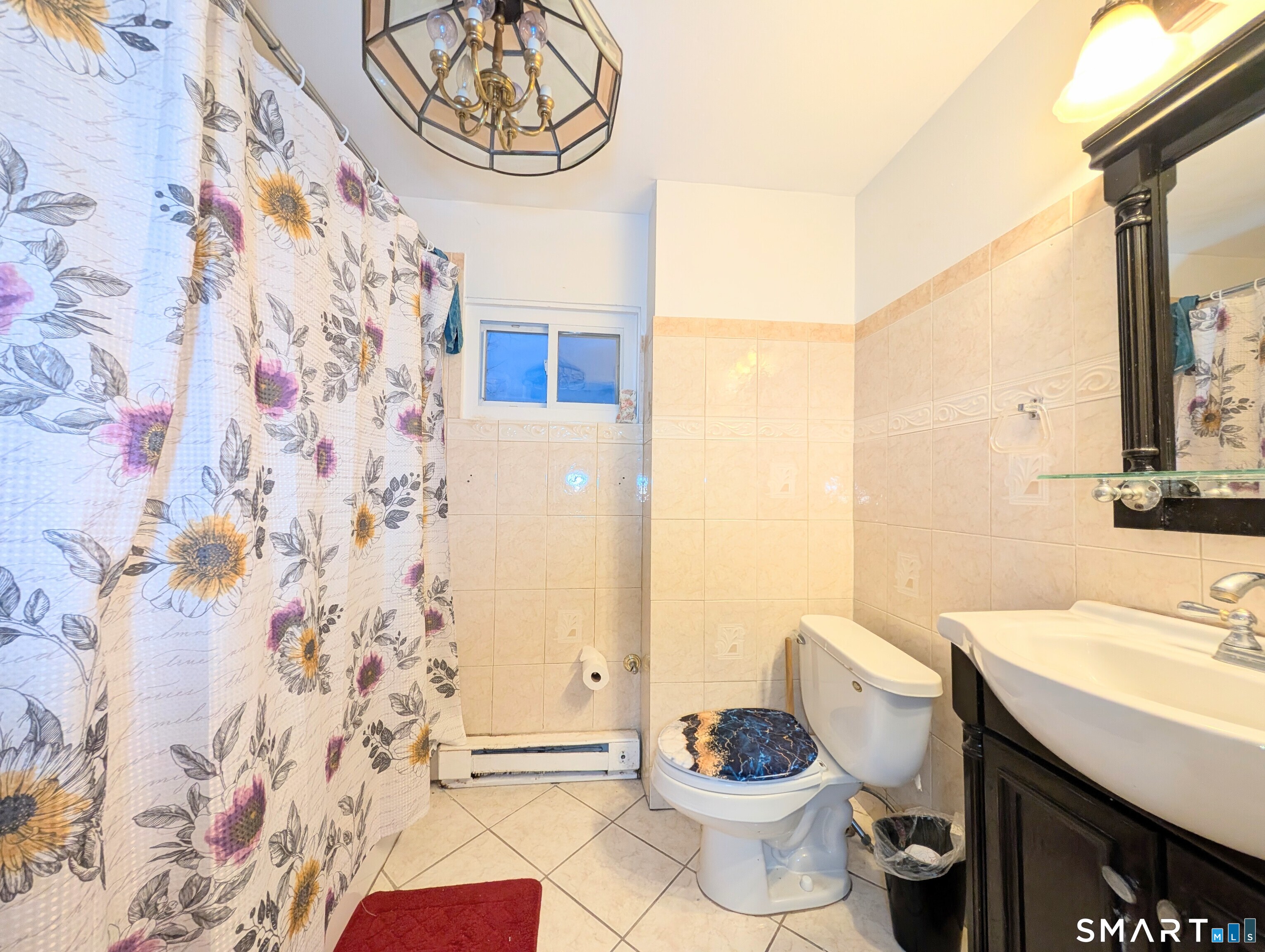 454 Pembroke Street Bridgeport, CT 06608 - Photo 22 of 40 a bathroom with a sink toilet and shower