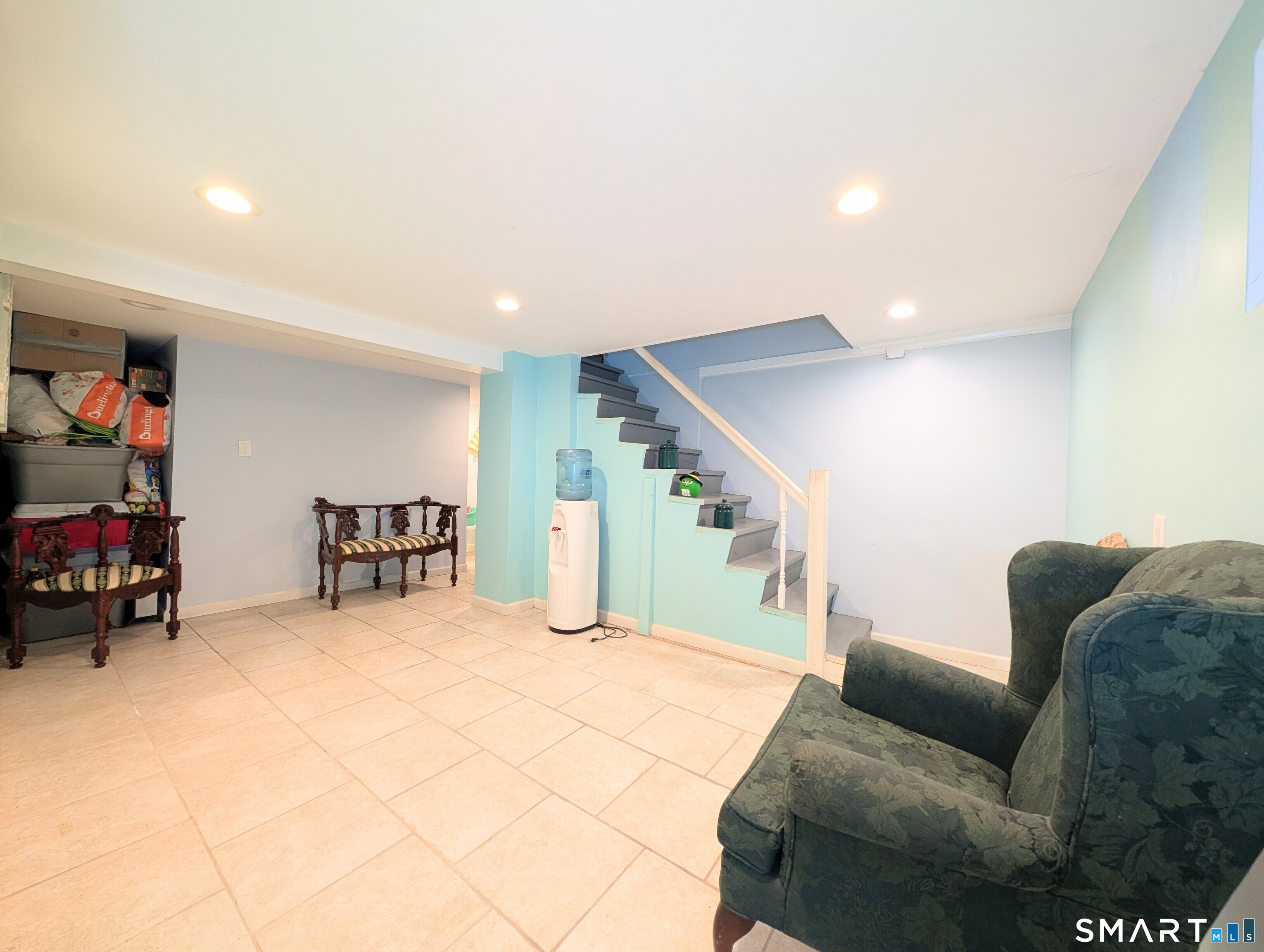 454 Pembroke Street Bridgeport, CT 06608 - Photo 27 of 40 a living room with furniture and stairs