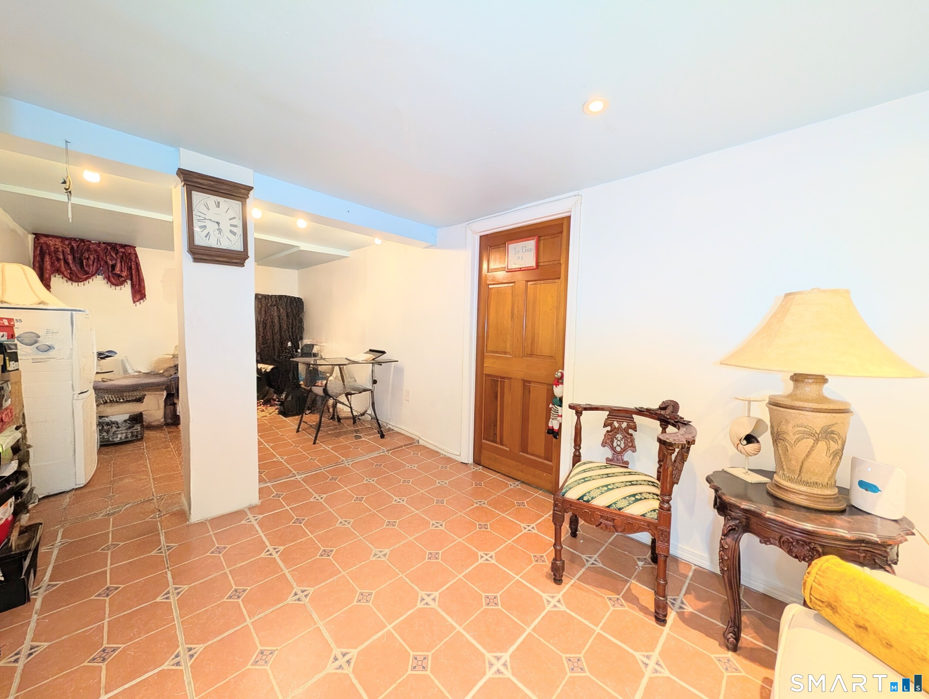 454 Pembroke Street Bridgeport, CT 06608 - Photo 29 of 40 a view of a living room with furniture and a rug