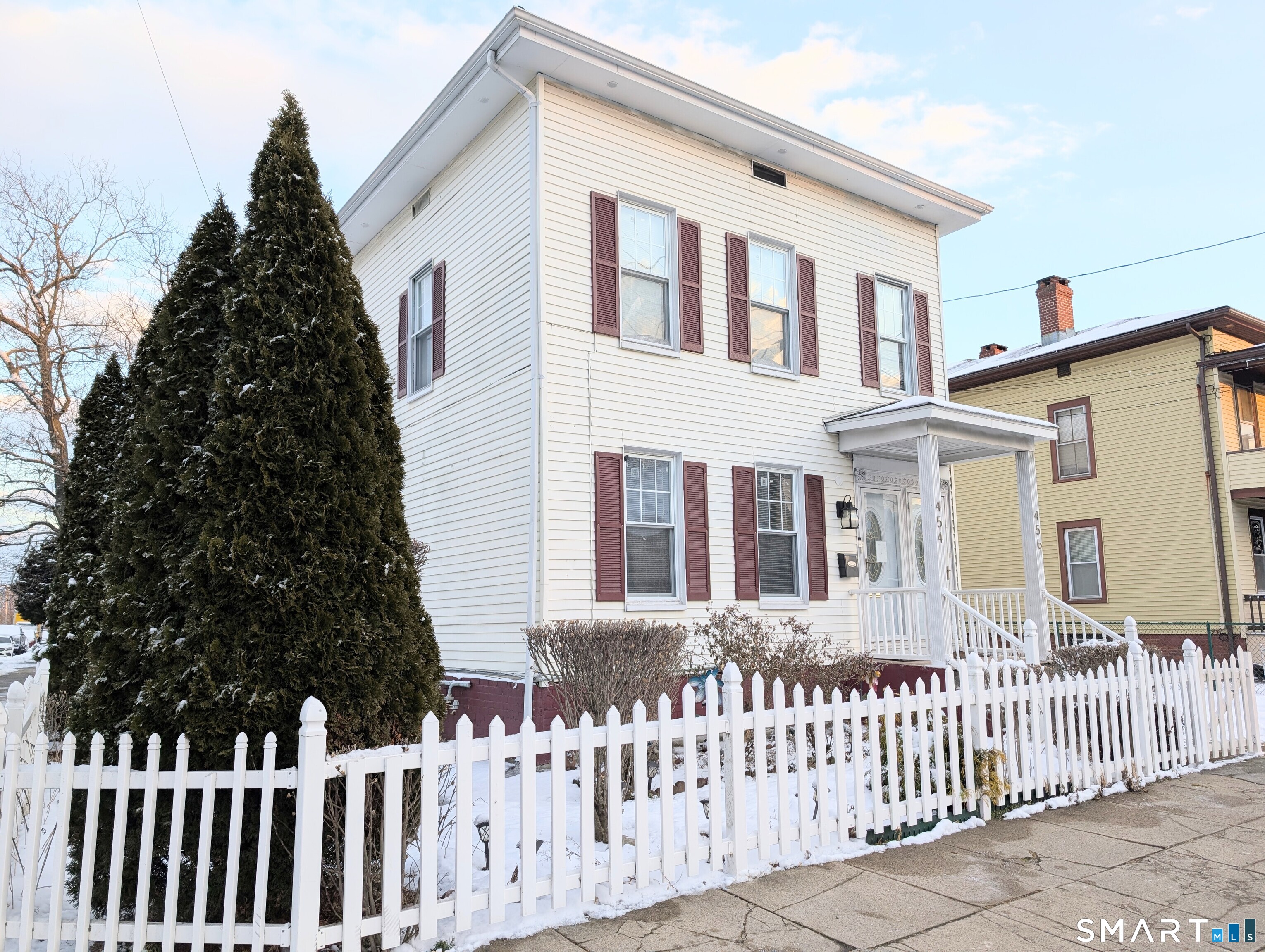 454 Pembroke Street Bridgeport, CT 06608 - Photo 3 of 40 a front view of a house with a garden