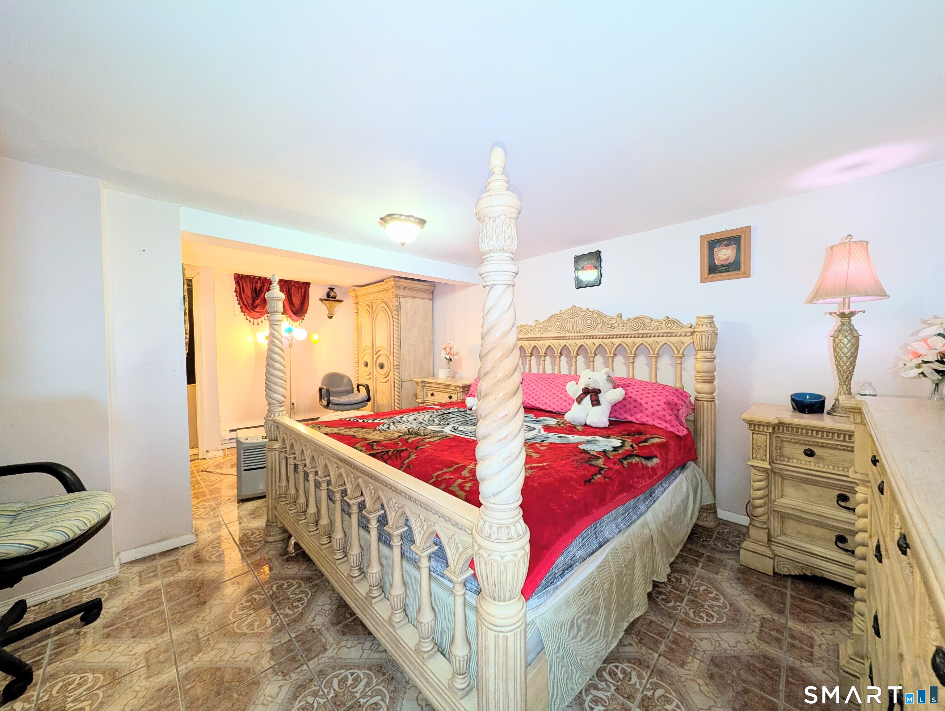 454 Pembroke Street Bridgeport, CT 06608 - Photo 34 of 40 a bedroom with furniture and a baby crib