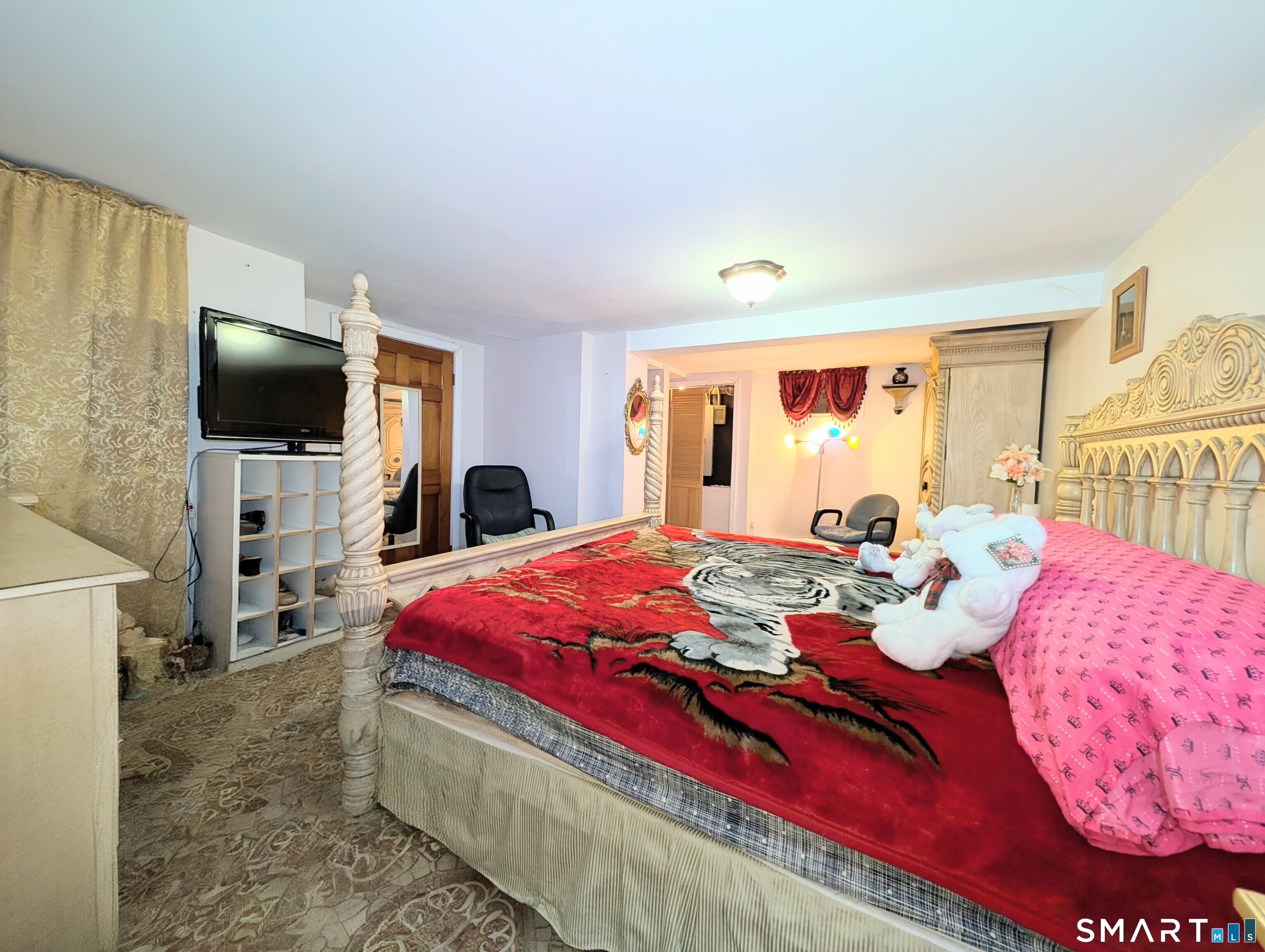 454 Pembroke Street Bridgeport, CT 06608 - Photo 35 of 40 a bedroom with a bed and a flat screen tv