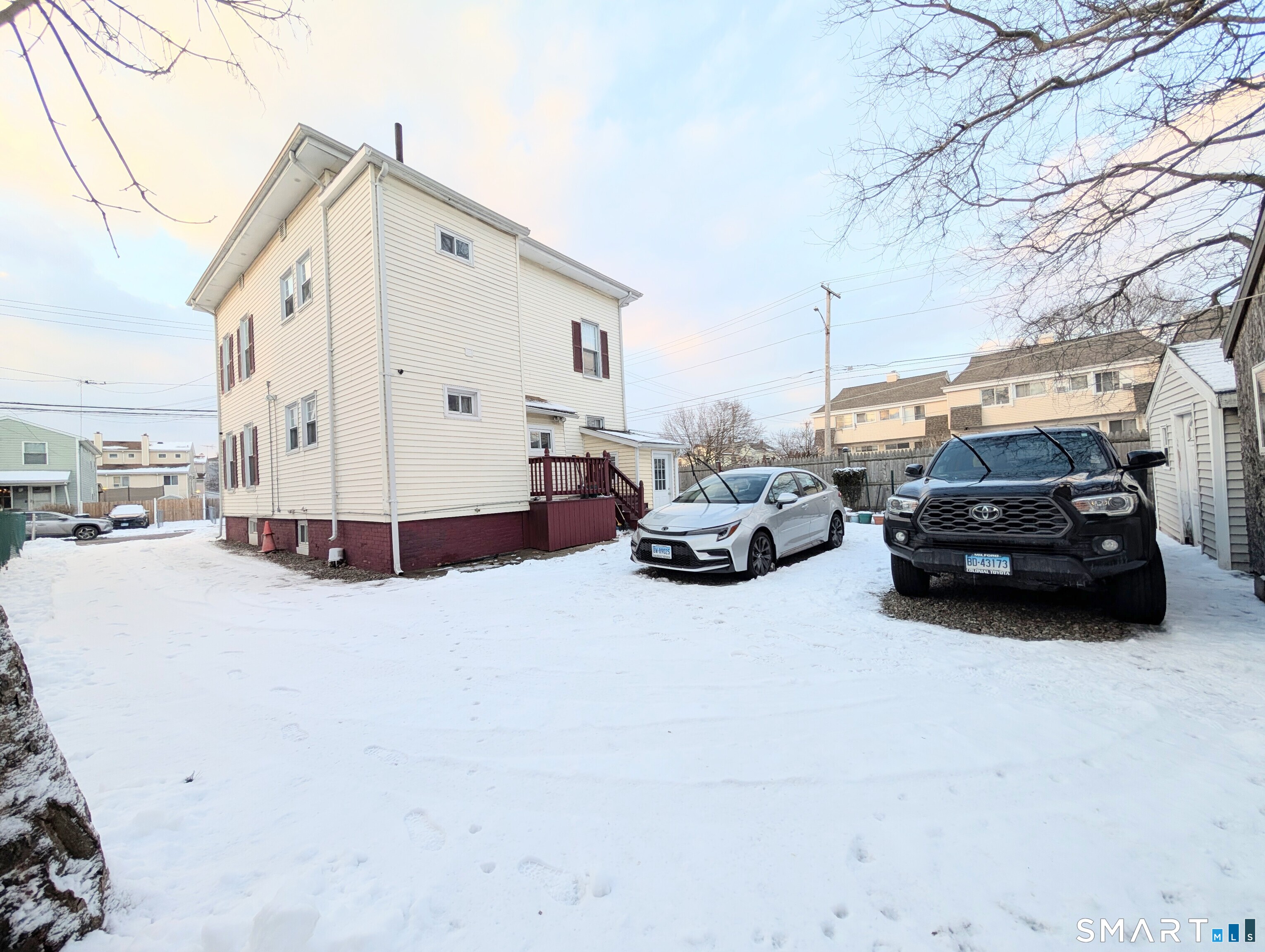 454 Pembroke Street Bridgeport, CT 06608 - Photo 40 of 40 a view of a cars park in front of house