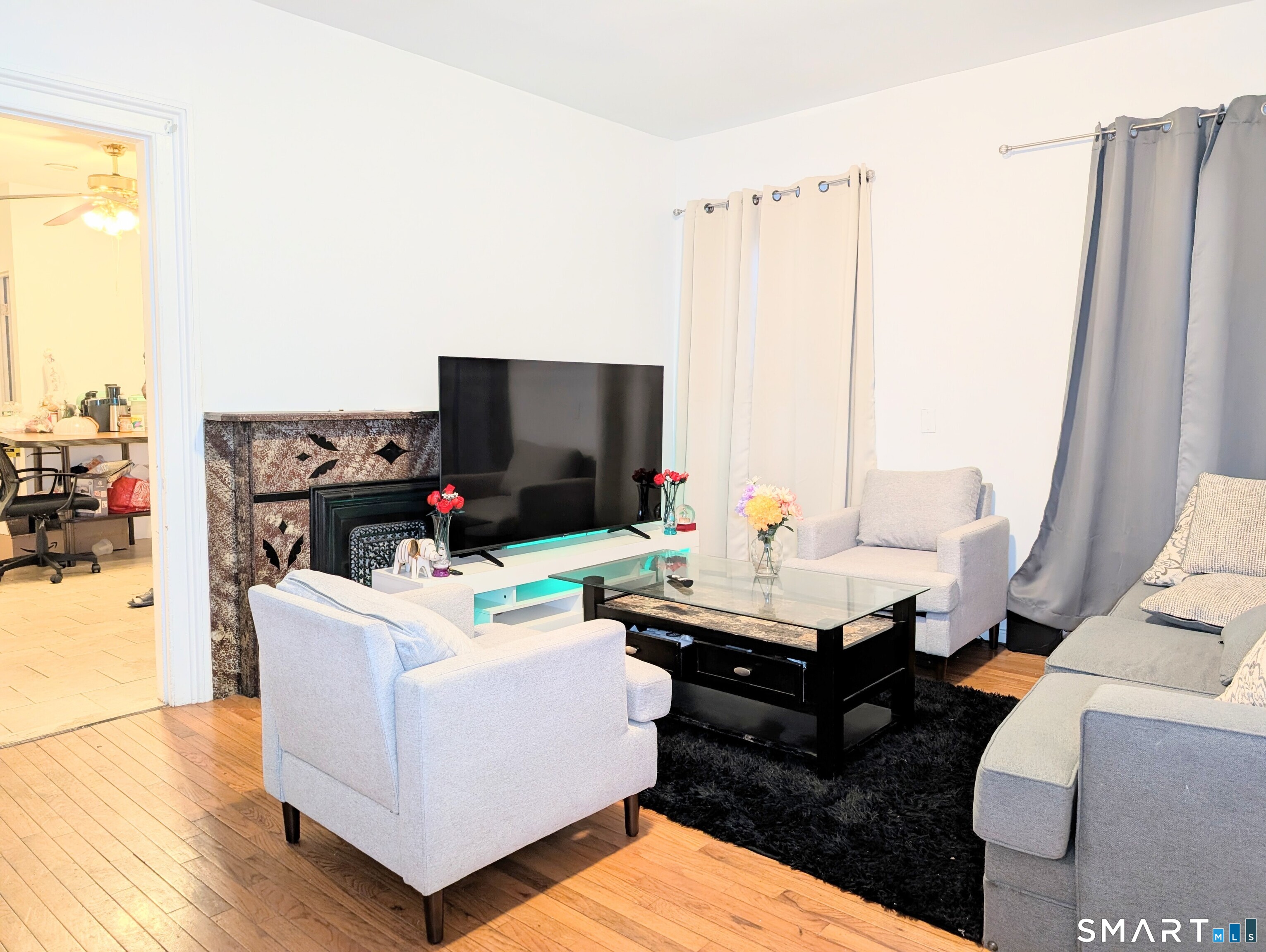 454 Pembroke Street Bridgeport, CT 06608 - Photo 6 of 40 a living room with furniture and a flat screen tv