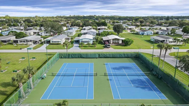 a view of a lake with boats and trees in the background