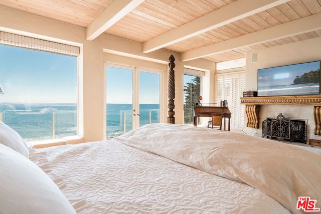 a en suite bathroom with a tub a sink and mirror