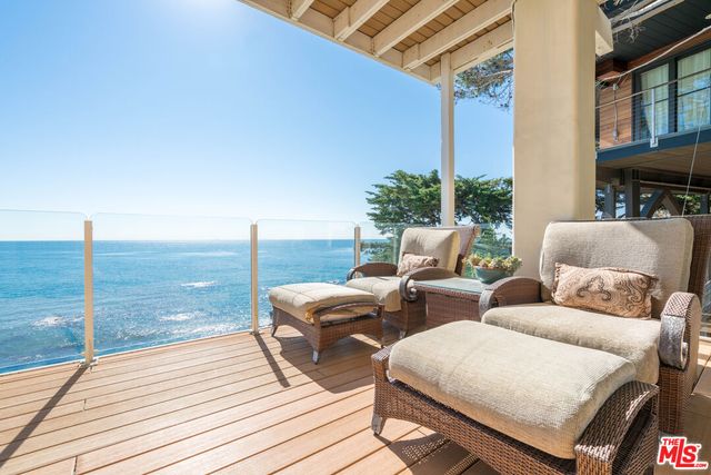 a balcony with chairs
