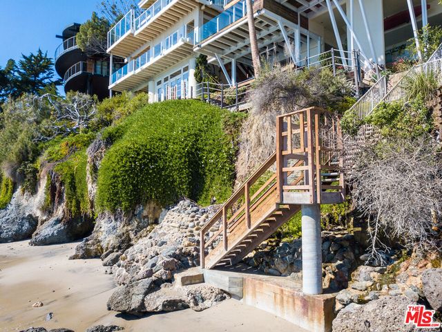 a view of a field with an ocean