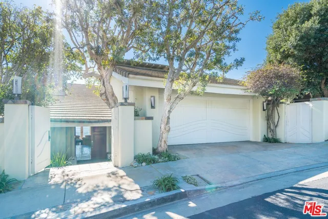 a living room with fireplace furniture and a flat screen tv