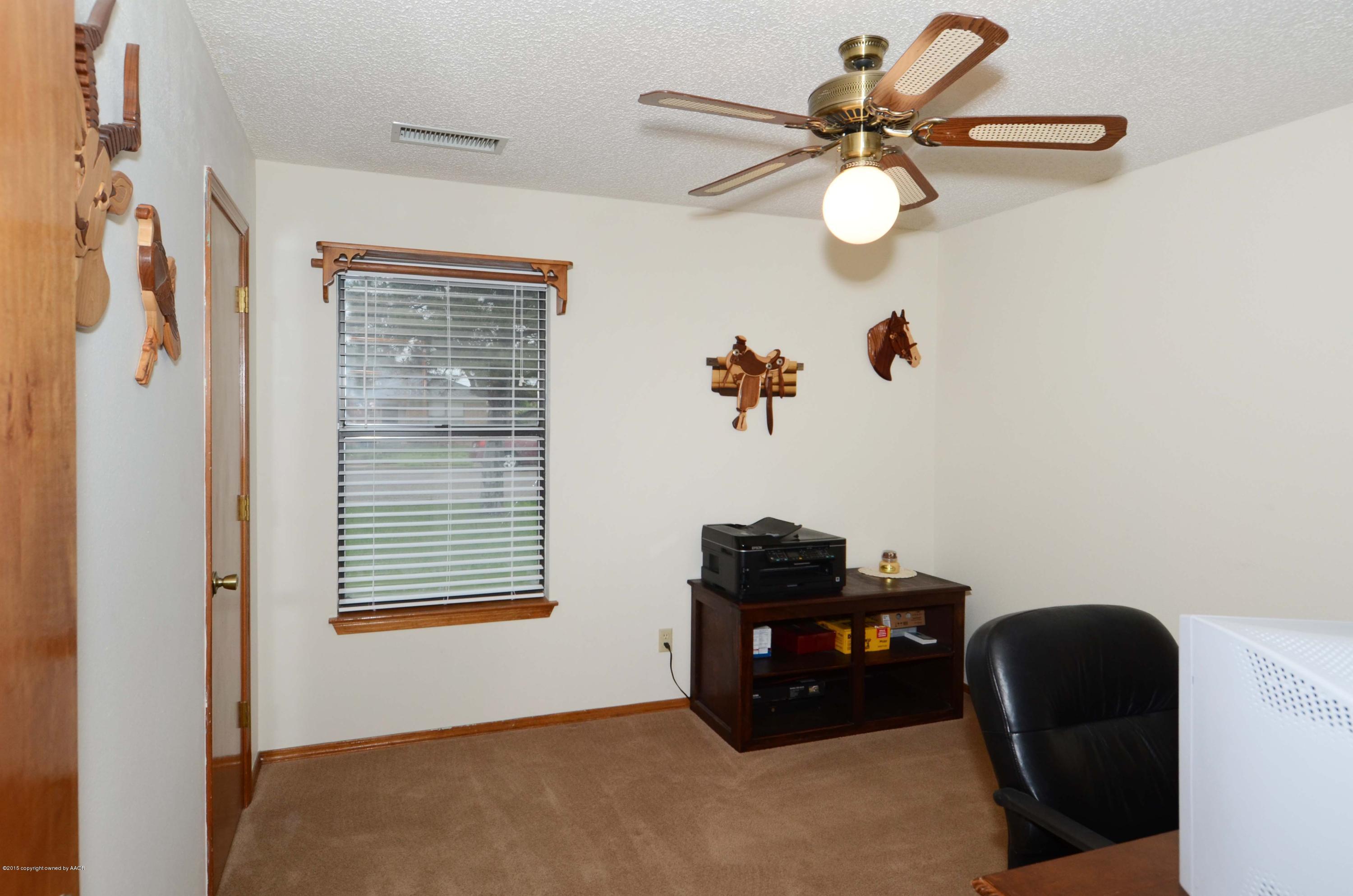 8104 Leah Trail Amarillo, TX 79110 - Photo 13 of 22 a workspace with furniture and a window