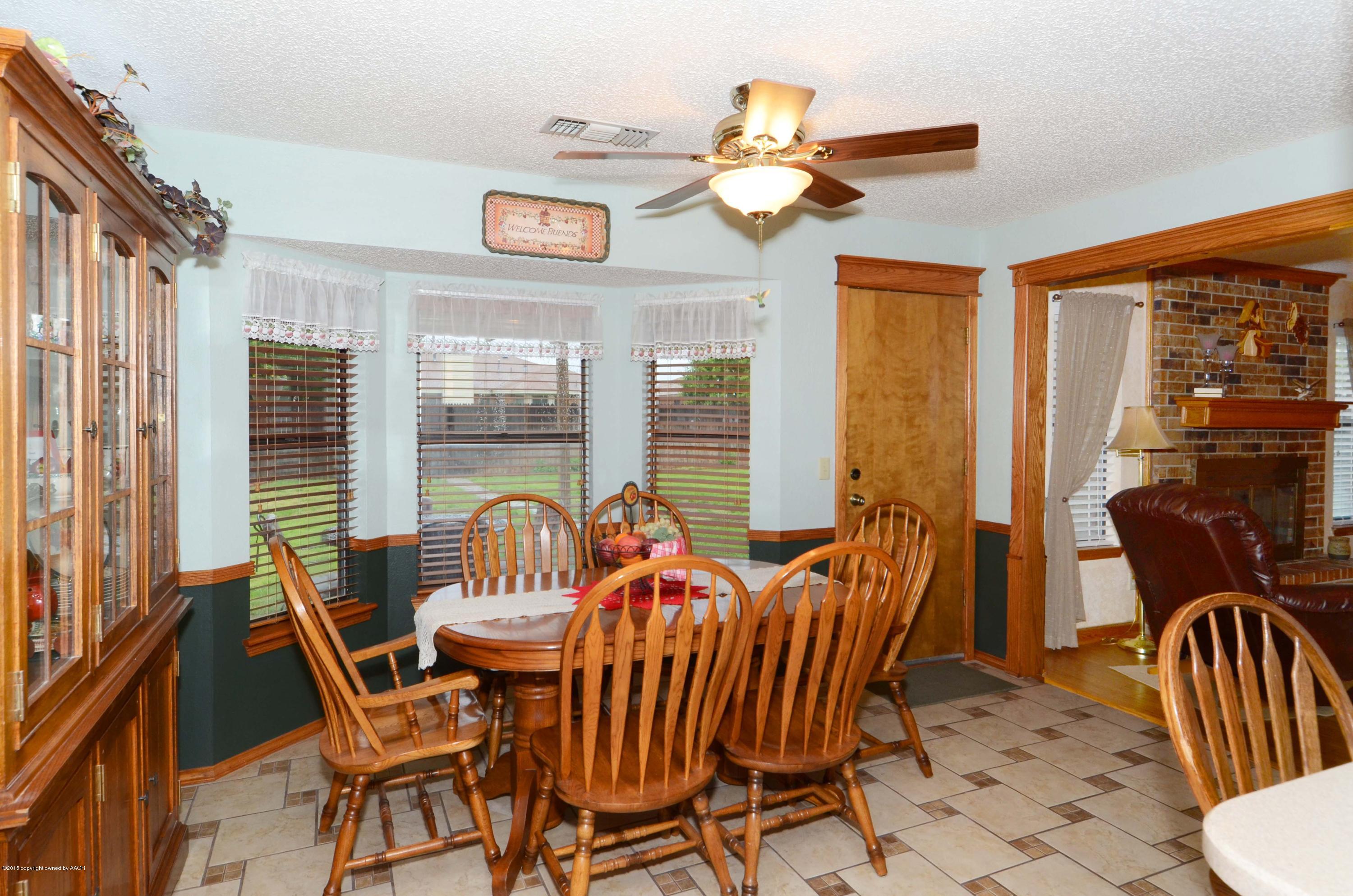8104 Leah Trail Amarillo, TX 79110 - Photo 6 of 22 a view of a dining room with furniture window and outside view