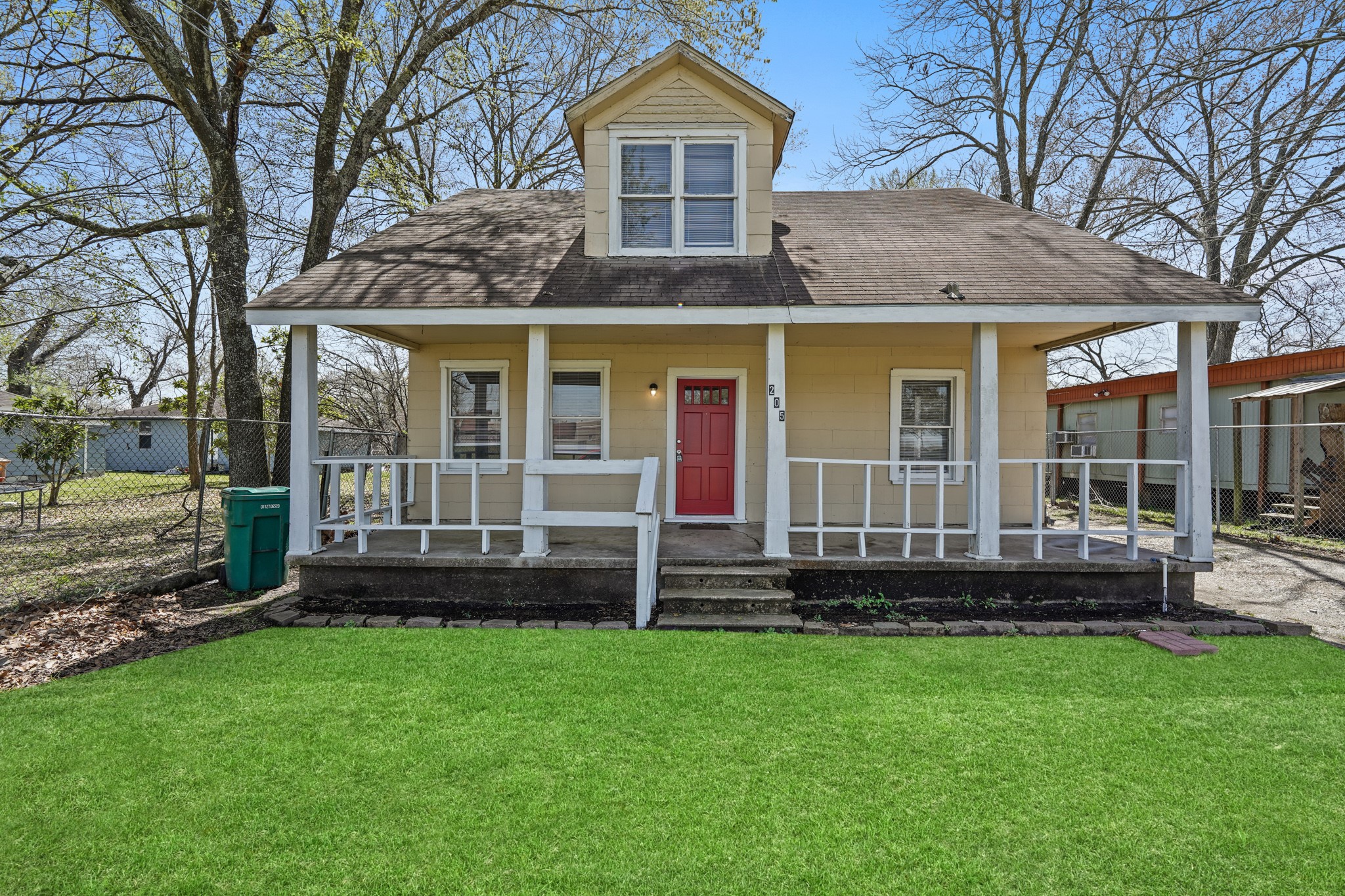 front view of a house with a yard