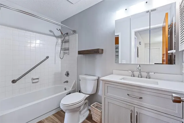 a bathroom with a sink a toilet and a bathtub